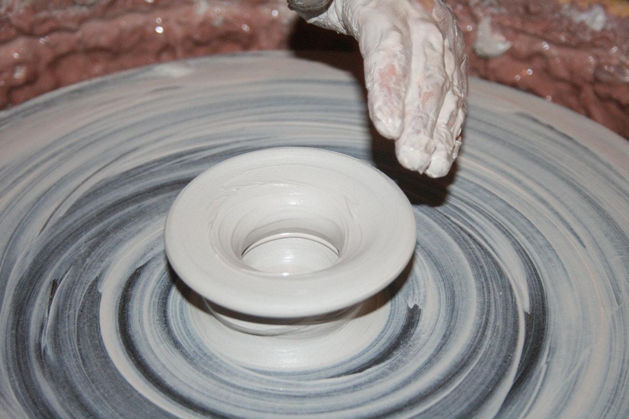 Person Making Clay Pot