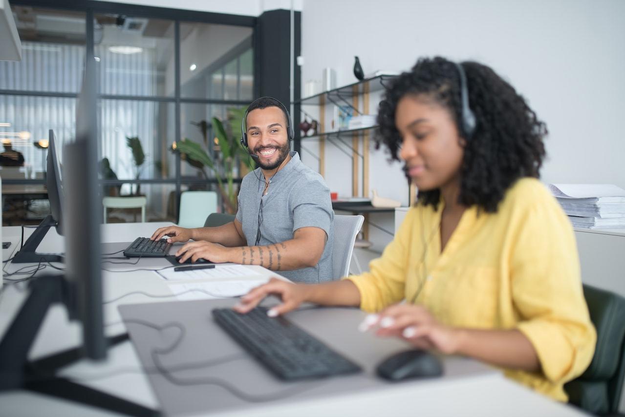 A Man and a Woman Working in Call Center