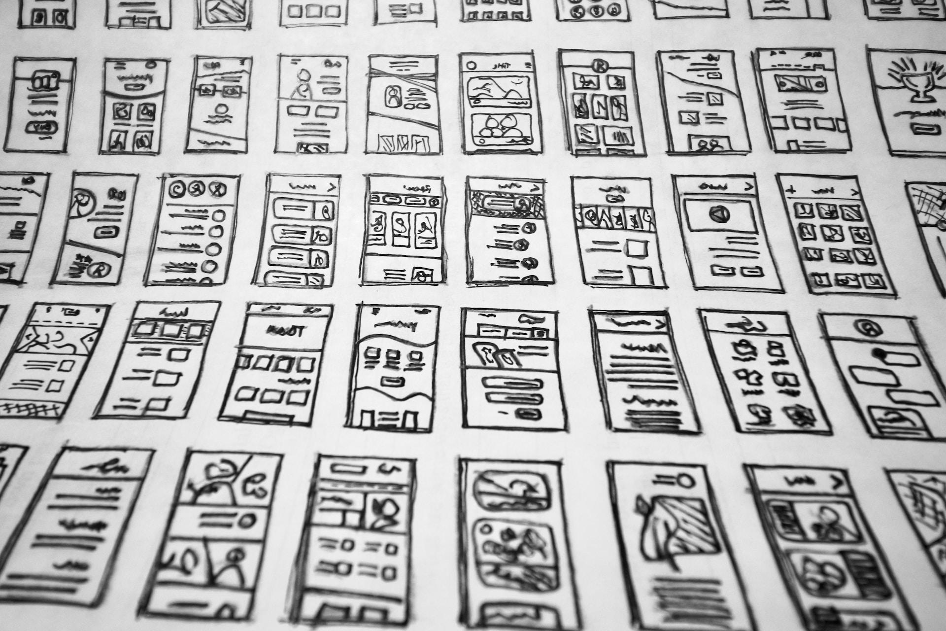 A whole slew of hand-drawn website layouts in black and white.